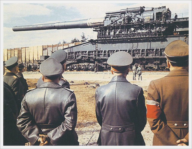 Hitler looking at the Gustav Railway gun (1942)