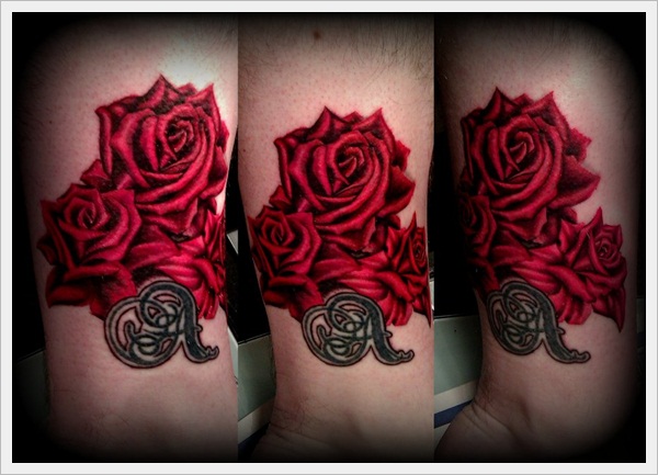 Red realistic roses tattoo